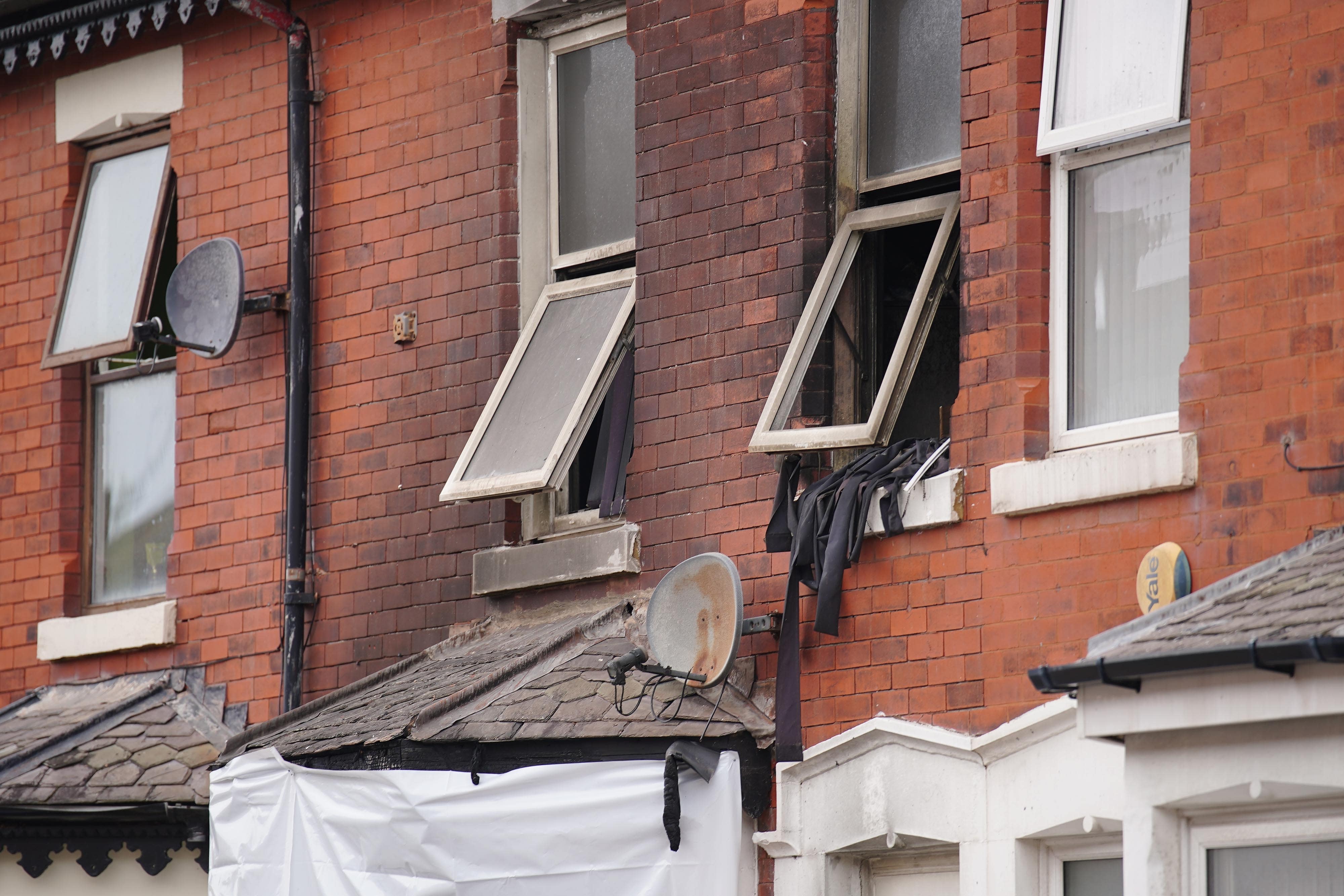 The scene of a house fire in Blackpool in which two people died and two children were admitted to hospital (Peter Byrne/PA)