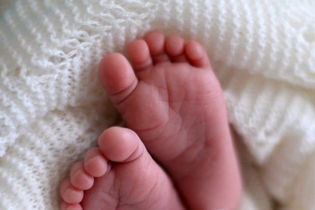 A new born baby’s feet (Andrew Matthews/PA)