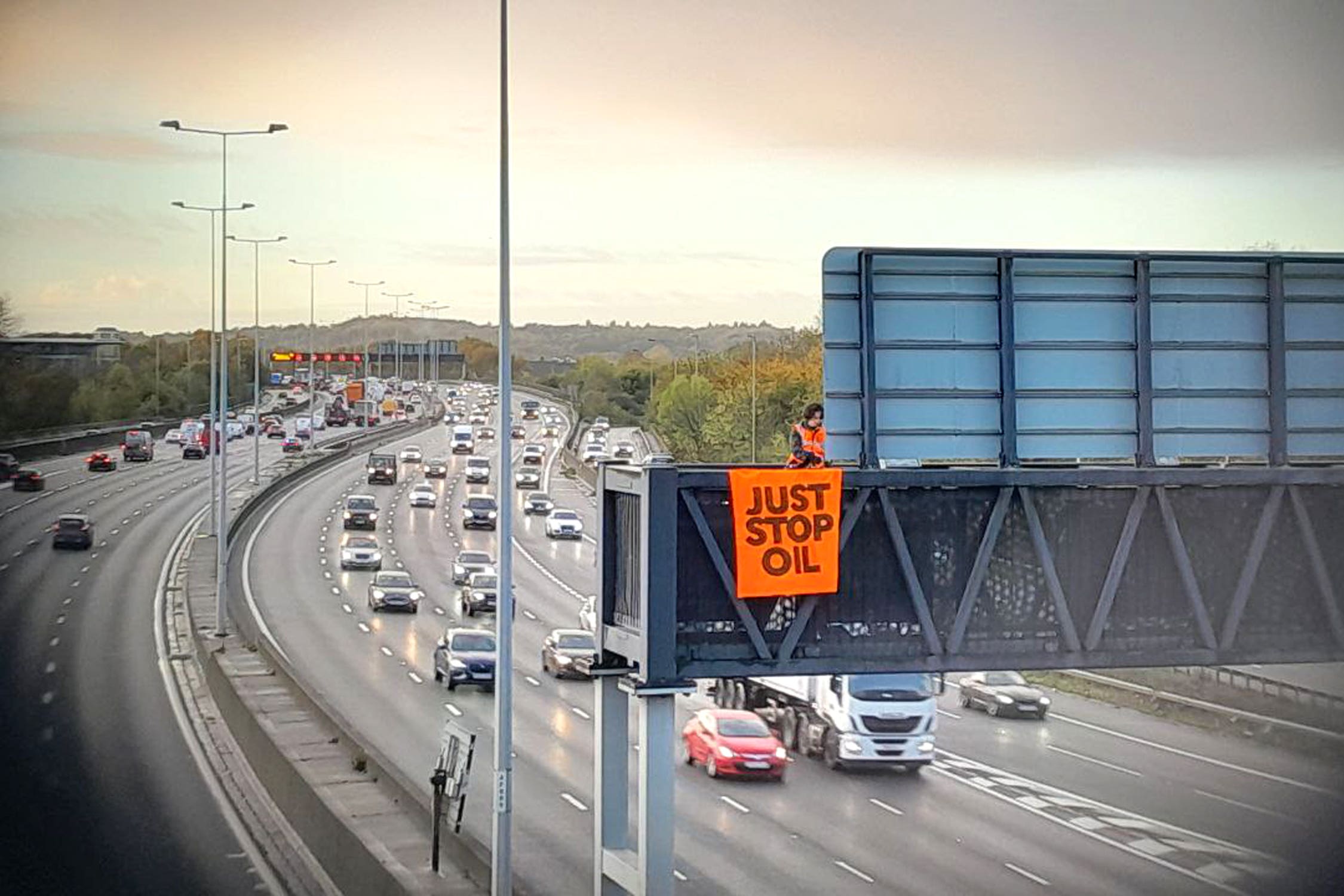 Protesters climbed gantries over the M25 and brought traffic to a standstill (Just Stop Oil/PA)