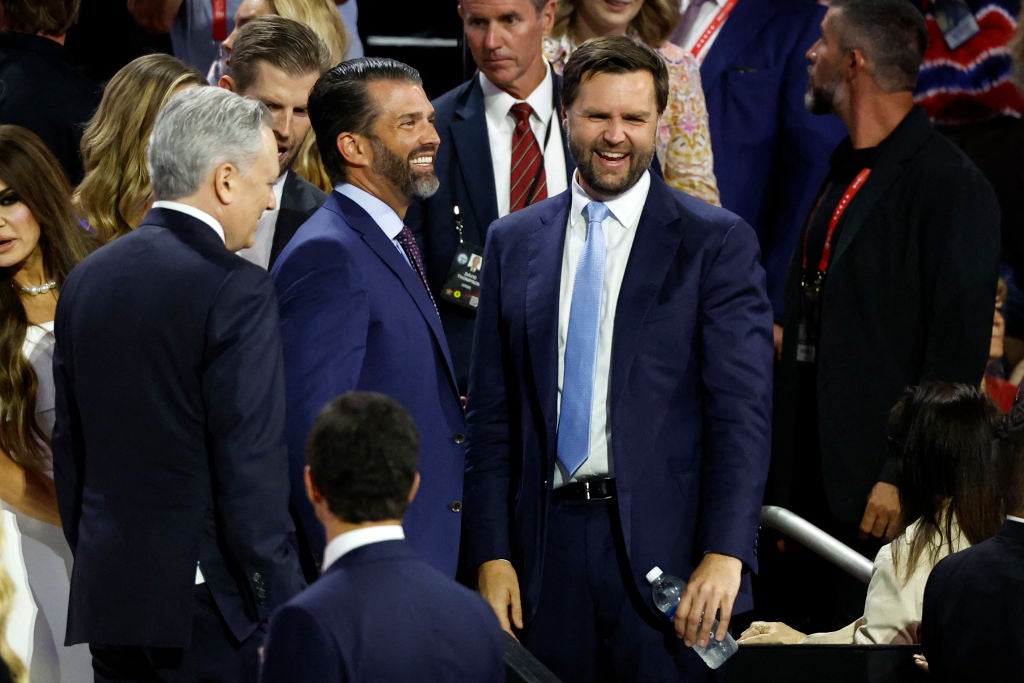 Republican vice presidential nominee JD Vance is seen laughing with Donald Trump Jr on day one of the 2024 Republican National Convention in Milwaukee.