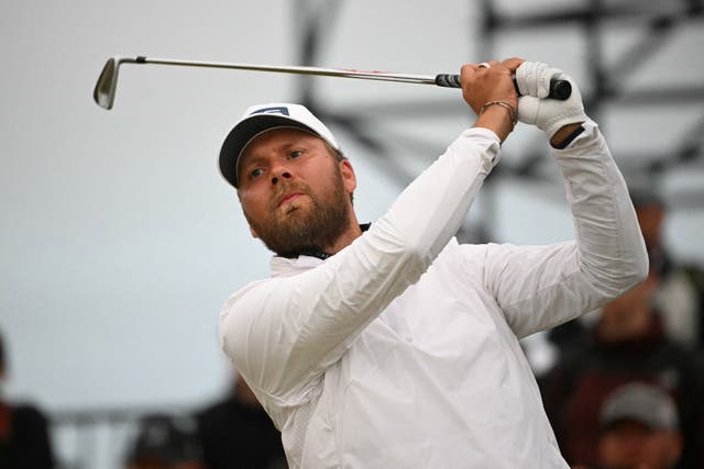 <p>England's Daniel Brown watches his iron shot from the 17th tee</p>