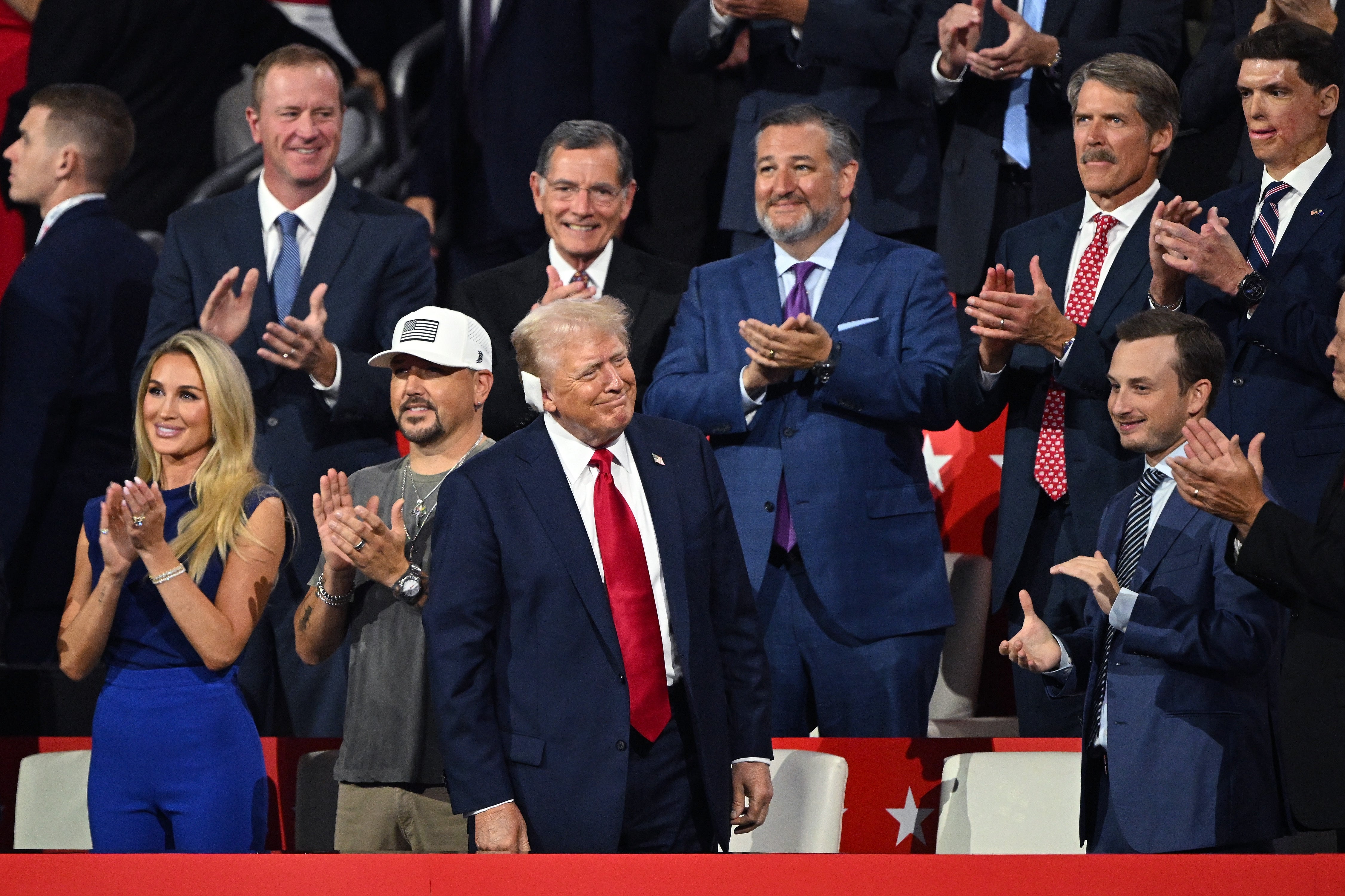 Donald Trump sits among several GOP senators on night four of the Republican National Convention