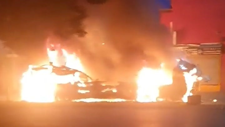 A double-decker bus has been engulfed in flames after rioting broke out in Leeds, with hundreds of people on the streets.