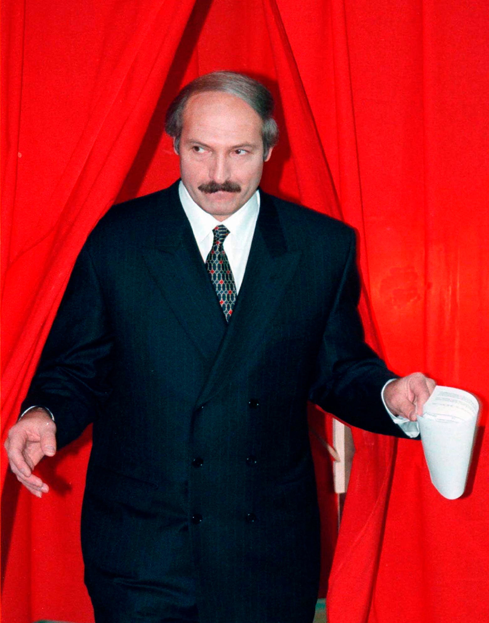 Lukashenko emerging from a polling booth in November 1996 after voting in a national referendum