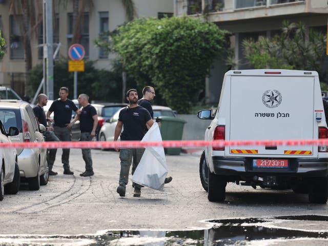 <p>Police inspect the damage at the scene of the drone attack in Tel Aviv on 19 July 2024</p>