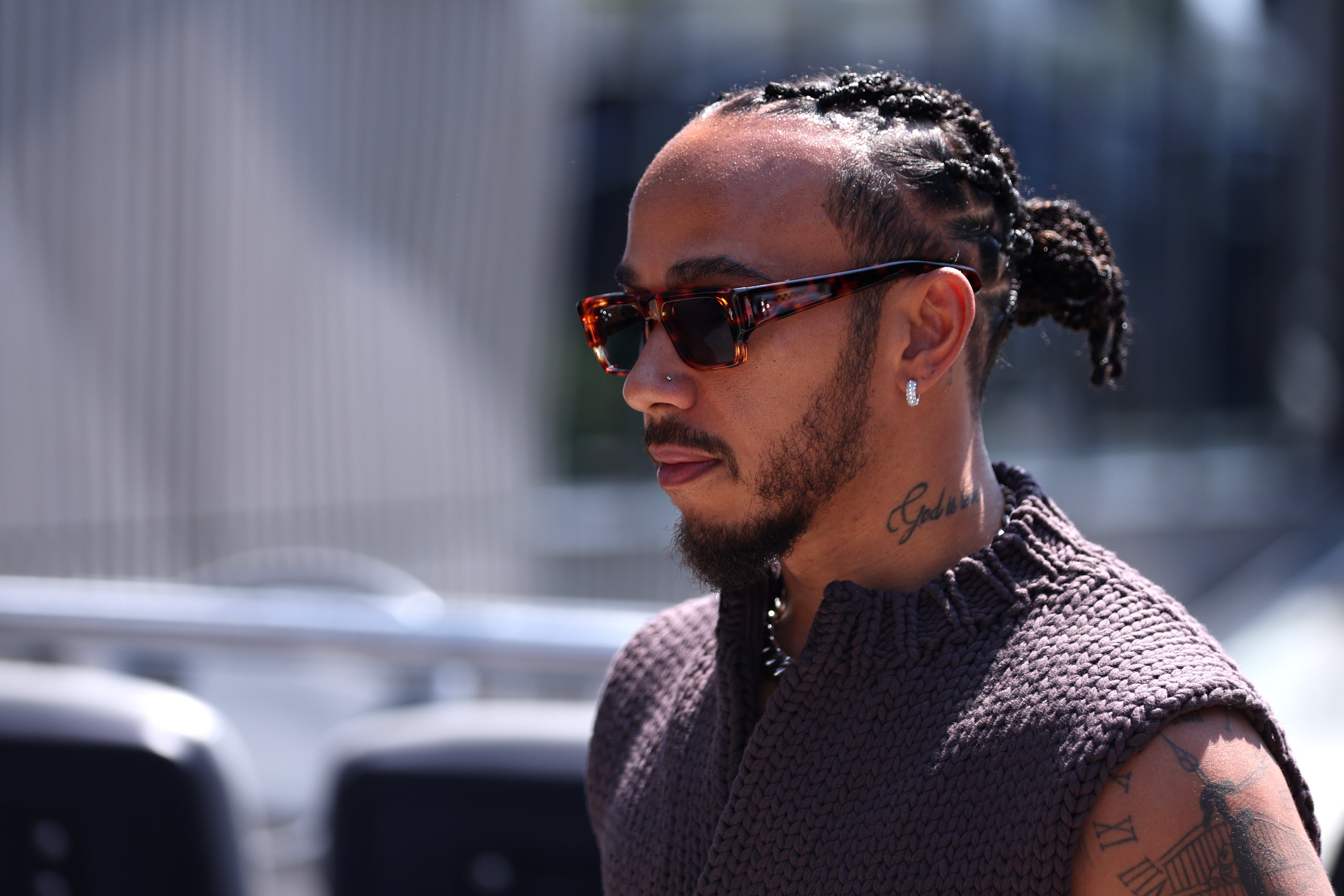 Lewis Hamilton of Great Britain and Mercedes walks in the Paddock