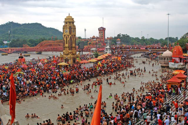 <p>Kanwariyas, the devotees of Hindu god Shiva, gather to collect holy water from river Ganges for 'Kanwar Yatra' pilgrimage during the holy month of Shravan at Har Ki Pauri in Haridwa</p>