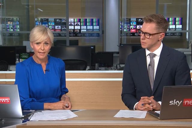 Sky News presenters read from a script on the Sky News channel, before the channel was knocked off air for the second time on Friday morning (Sky News/PA)
