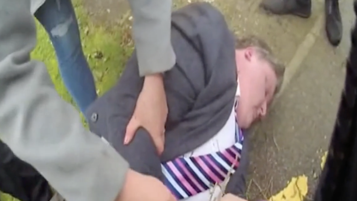 Video: Headteacher who harassed junior colleague on school social media pretends to pass out during arrest