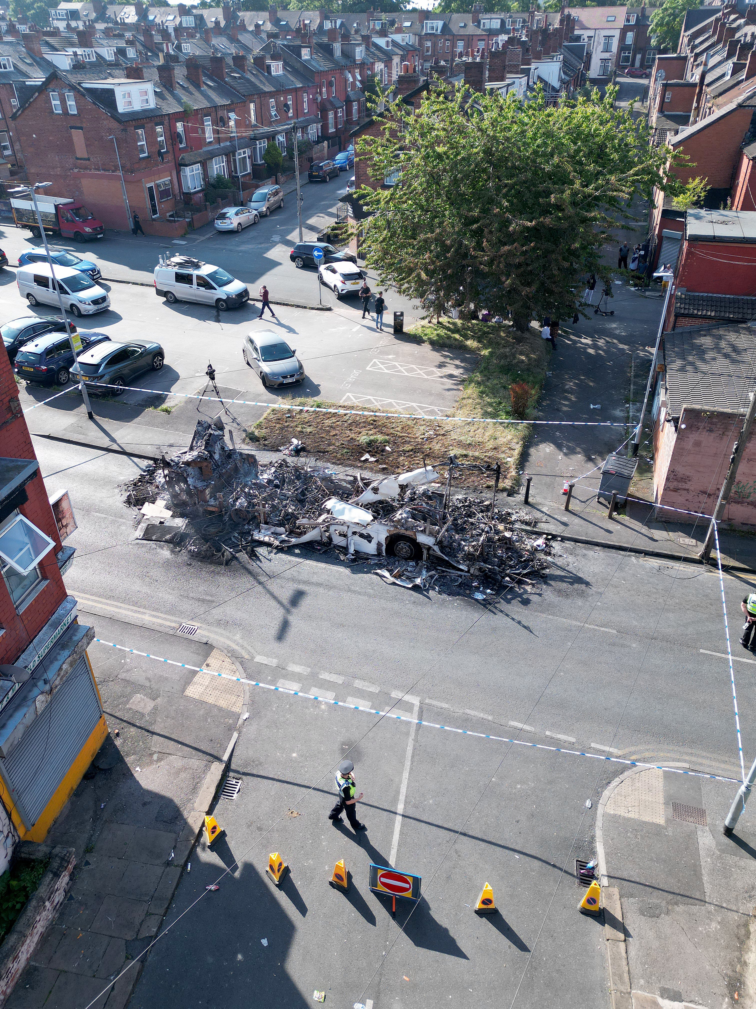 The remains of a burnt-out bus burn