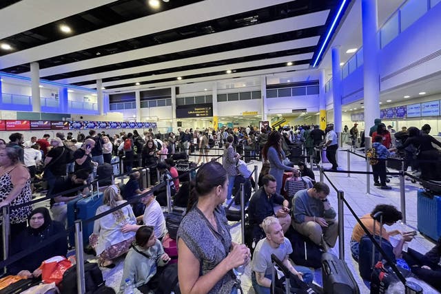 Passengers queuing at check-in desks at London Gatwick Airport (Serge Poliakoff/PA)