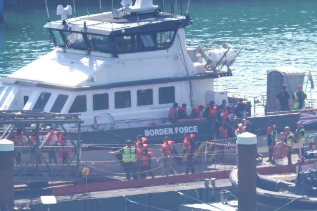 A group of people thought to be migrants are brought in to Dover, Kent, on a Border Force vessel (Gareth Fuller/PA)