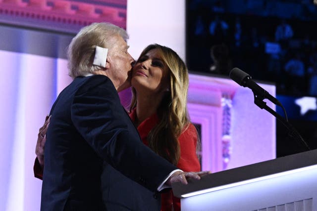 <p>Former US First Lady Melania Trump (R) kisses US former President and 2024 Republican presidential candidate Donald Trump as she joins him onstage during the last day of the 2024 Republican National Convention at the Fiserv Forum in Milwaukee, Wisconsin, on July 18, 2024</p>