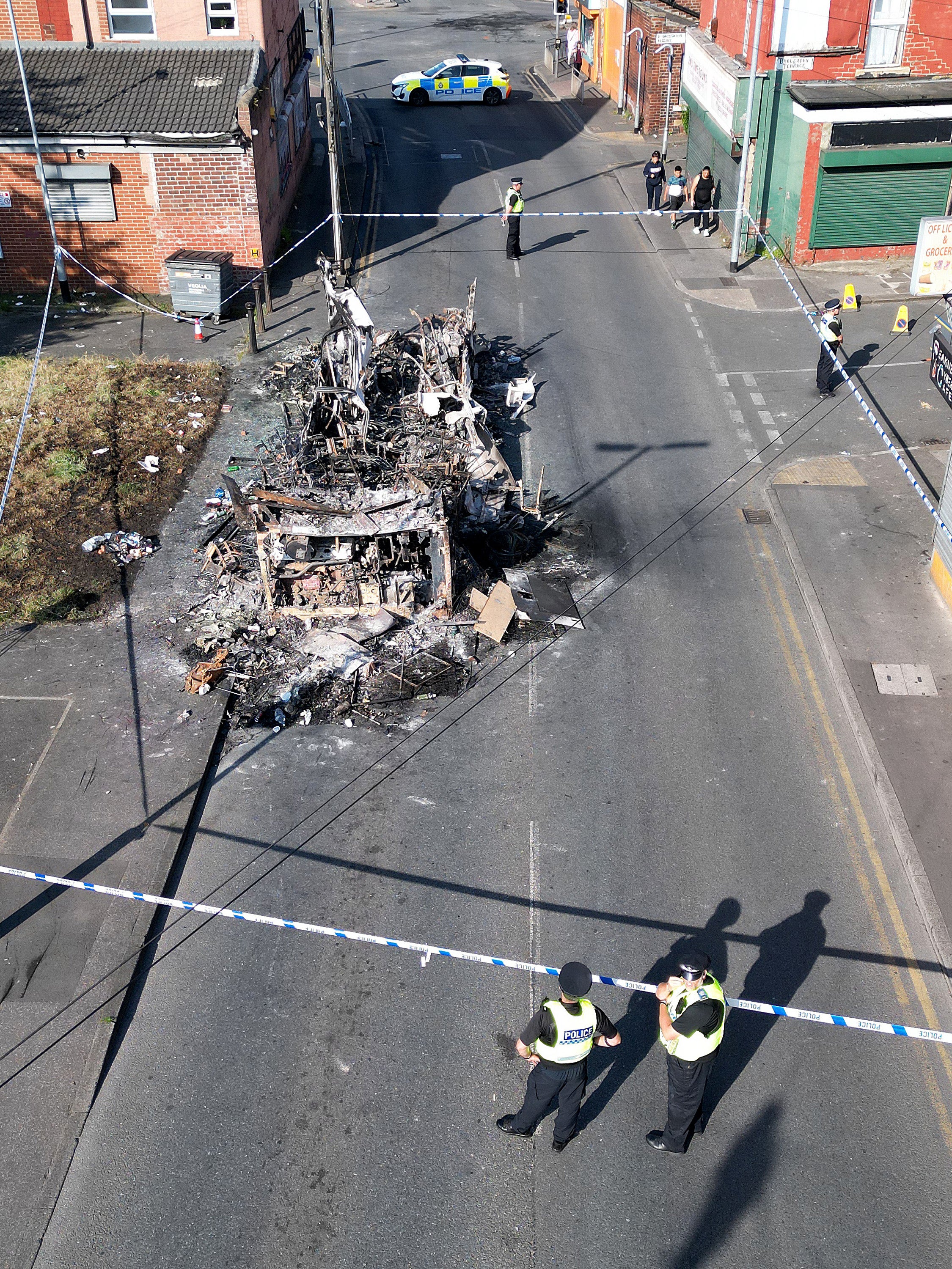 A police cordon was set up around the charred remains of the bus.