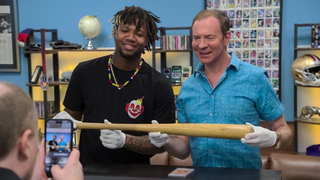 <p>The King of Collectibles himself, Ken Goldin, says most items that sell well do so because they have a story — such as this baseball bat held by baseball star Ronald Acuna Jr. </p>