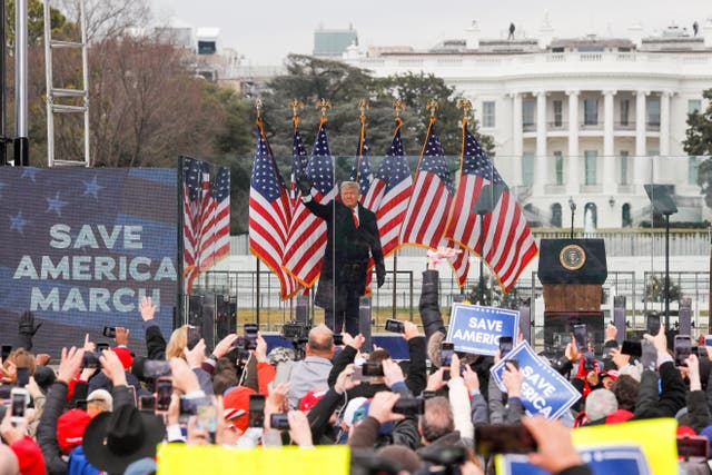 <p>Donald Trump waves to supporters at a rally in Washington DC before a mob stormed the Capitol on January 6, 2021. Congress members who investigated the attack are now calling on Joe Biden to drop out of the race or risk another Trump presidency. </p>