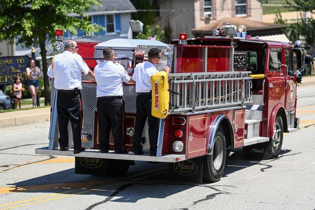 <p>A firetruck transported Comperatore’s casket</p>