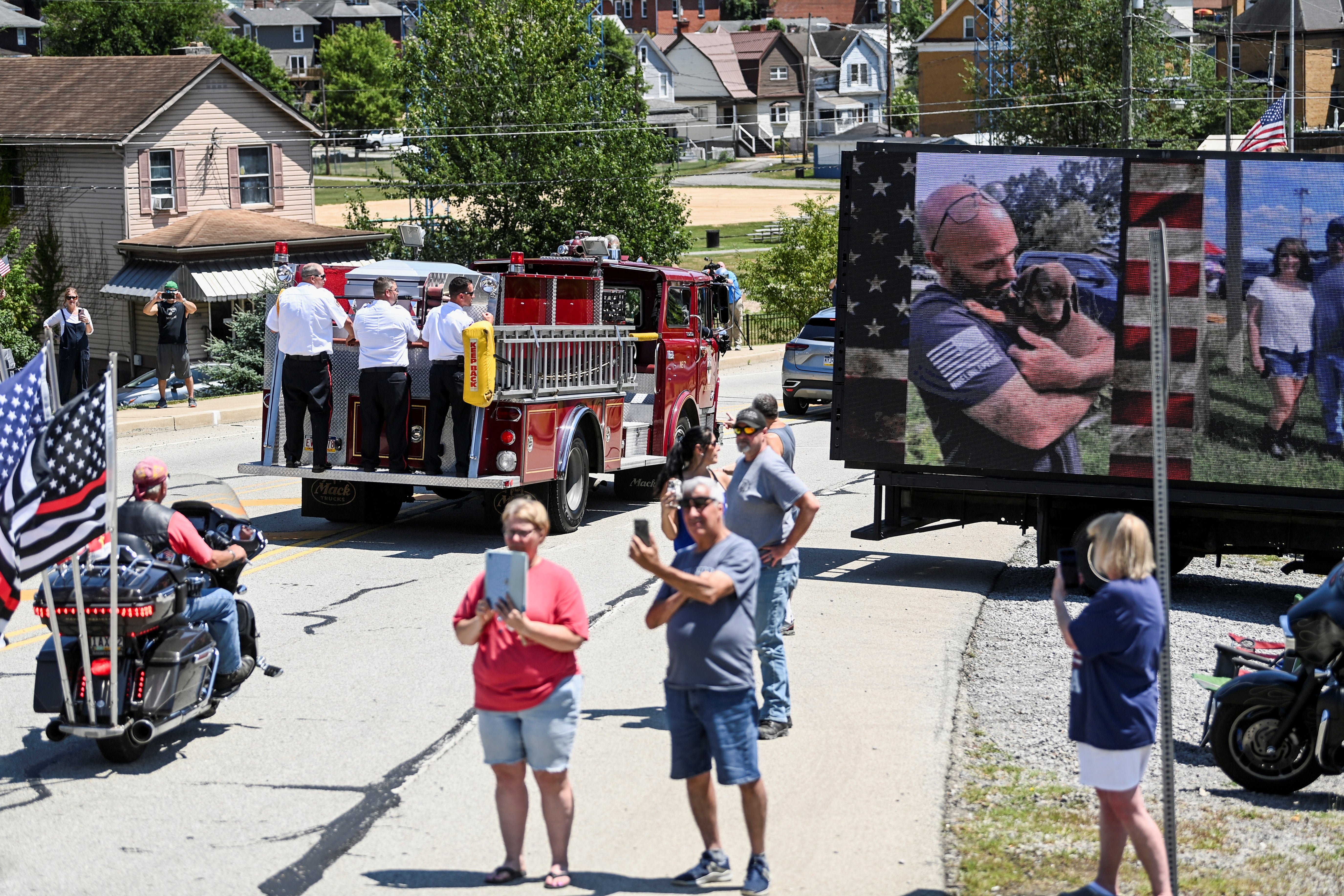 Comperatore’s casket was draped with the American flag