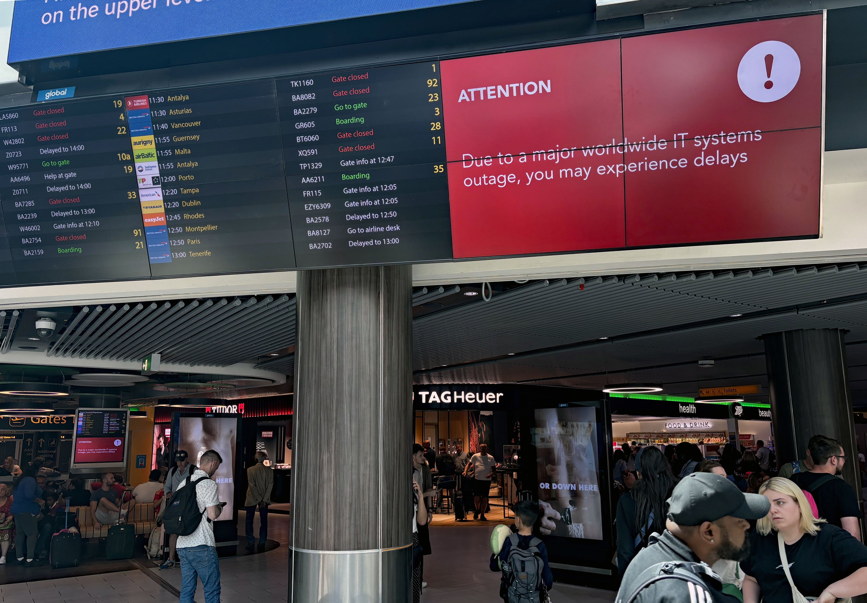 Passengers in the South Terminal at Gatwick Airport (Brian Lawless/PA)