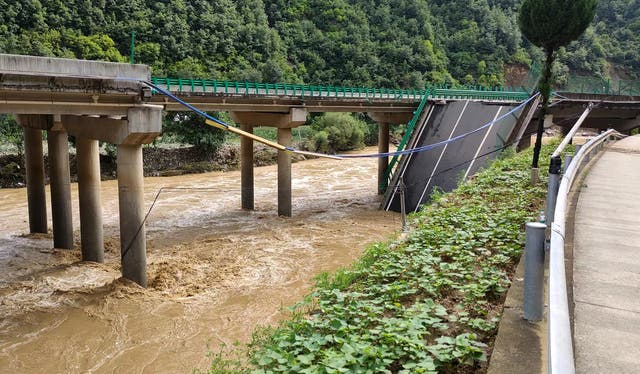 <p>A a collapsed bridge is seen in Zhashui County in Shangluo City, northwest China's Shaanxi Province, Saturday</p>