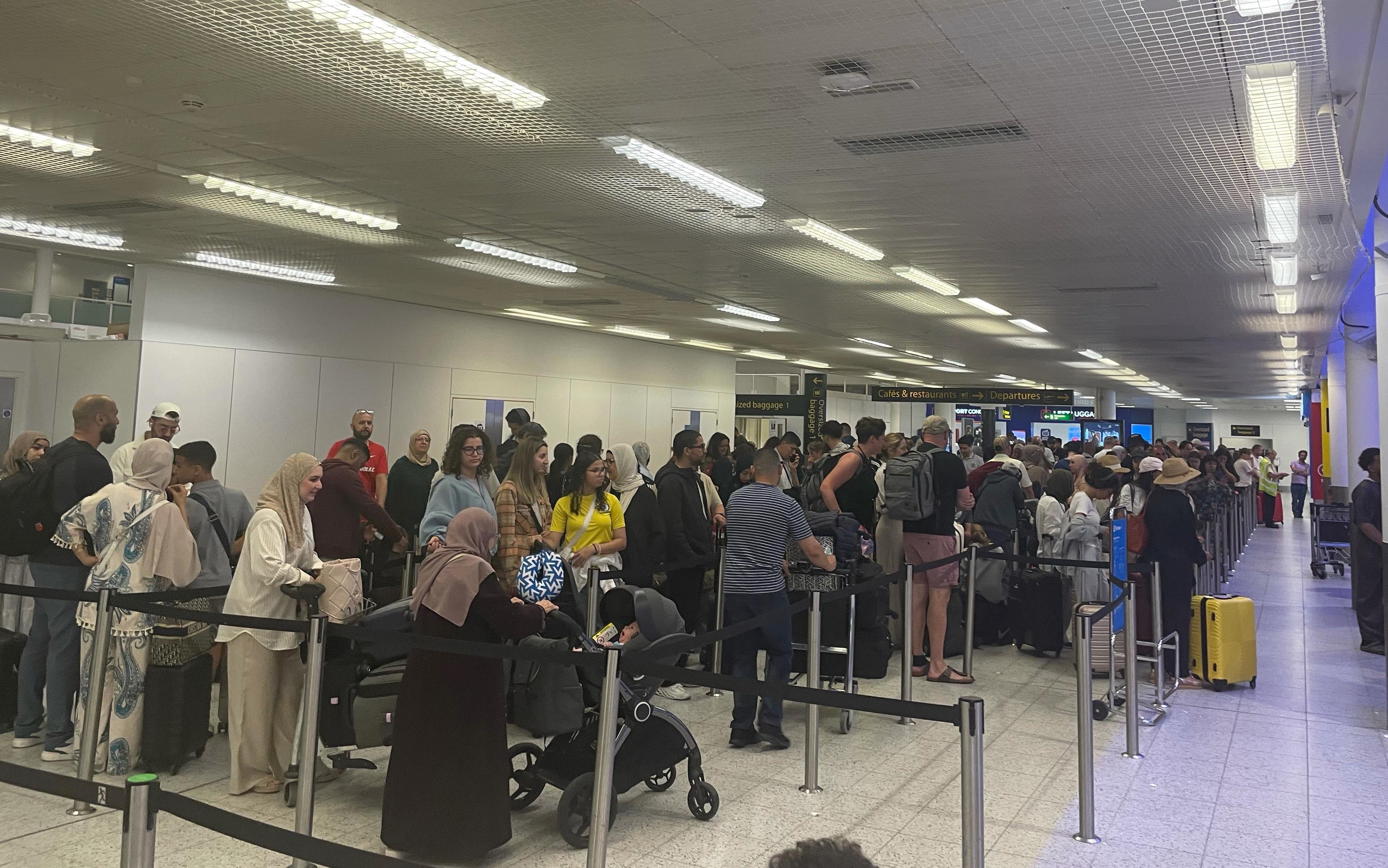 Passengers at Gatwick Airport as airlines continue to deal with the fallout from the global IT outage