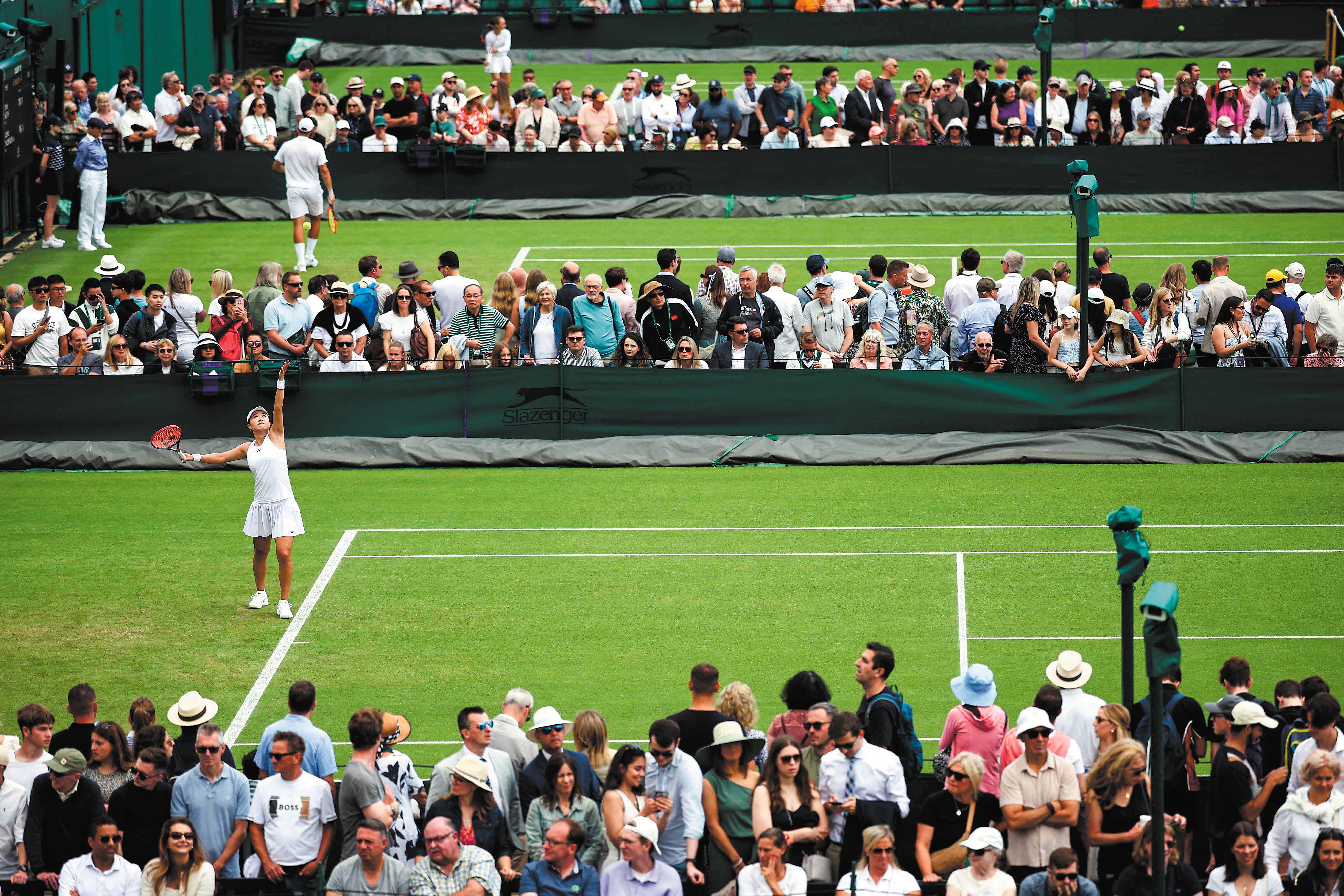 China’s Zhu Lin serves to Romania’s Irina-Camelia Begu during their women’s singles tennis match at Wimbledon on 1 July