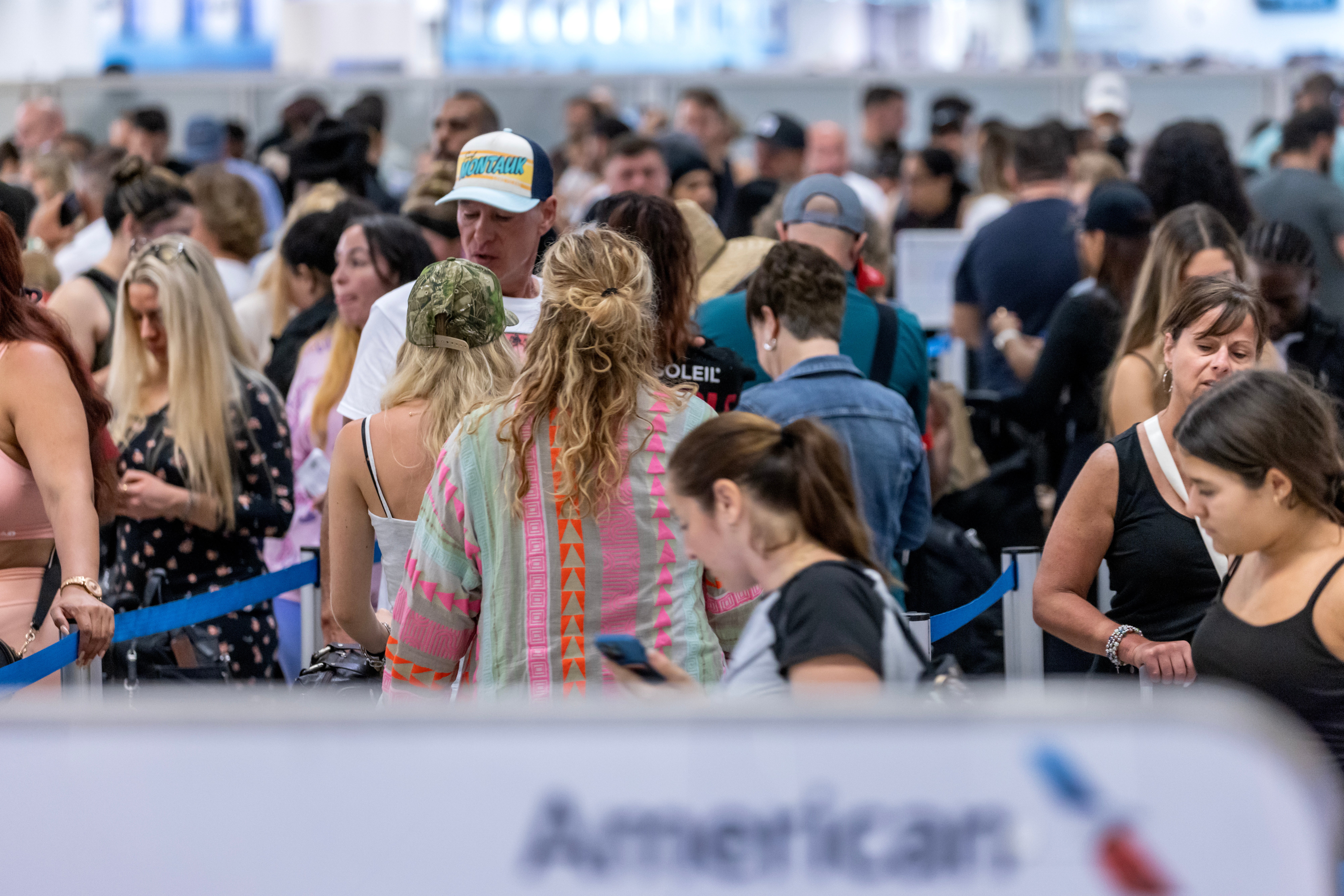 American Airline's International flights passengers line up to check in during a global technical outage at Miami International airport in Miami, Florida, USA, 19 July 2024