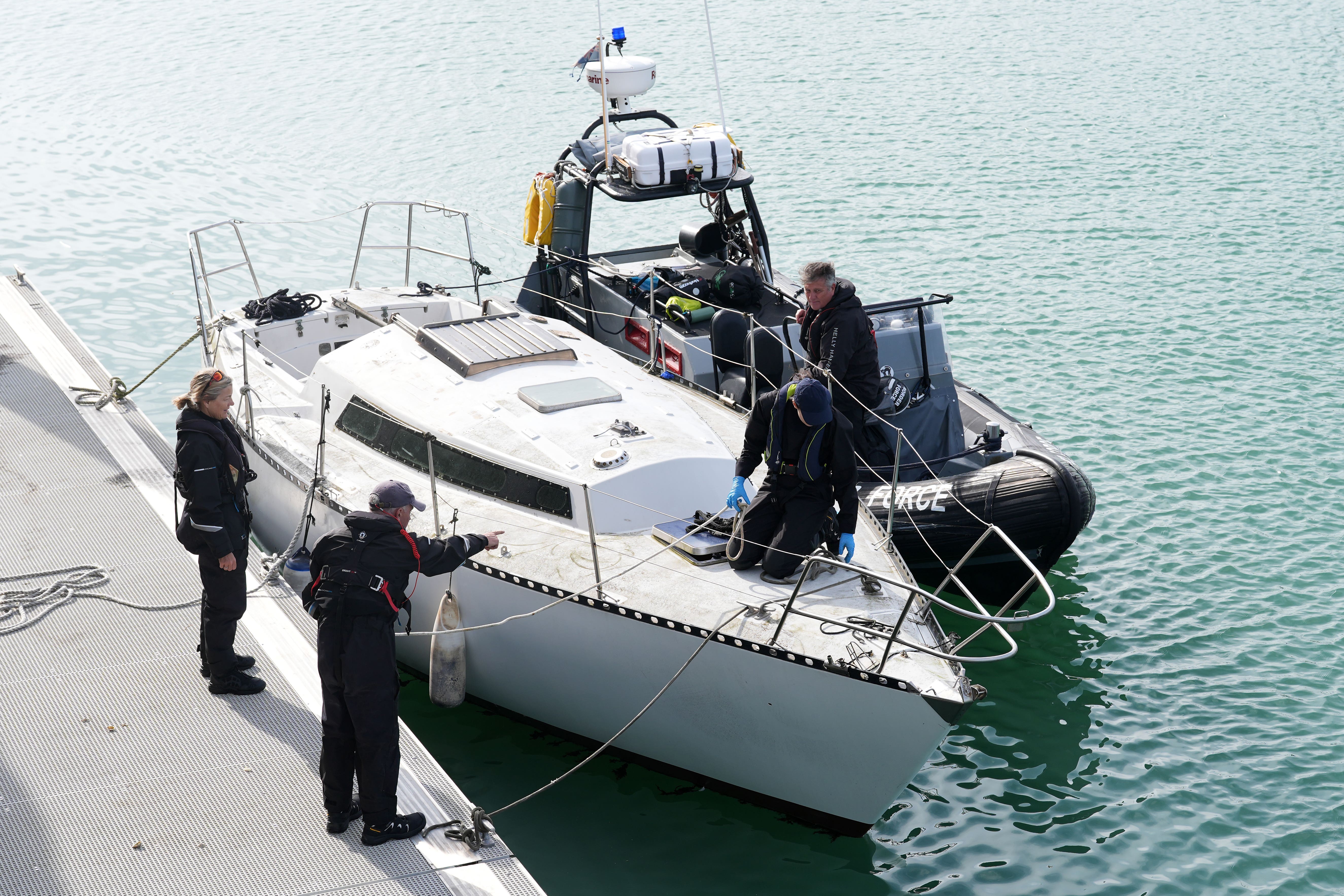 Border Force secure a yacht in the harbour (Gareth Fuller/PA)