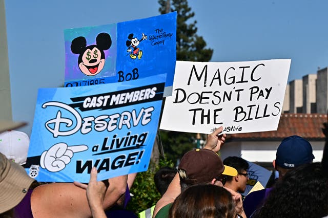 <p>Disney employees rally outside the main entrance of Disneyland Resort in Anaheim, California, on July 17, 2024, ahead of a planned strike authorization vote</p>