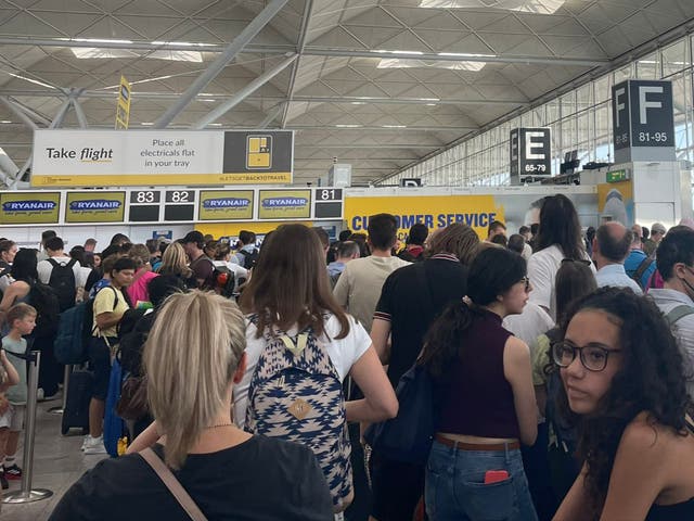 <p>Going places? Passengers at Stansted airport on Friday </p>