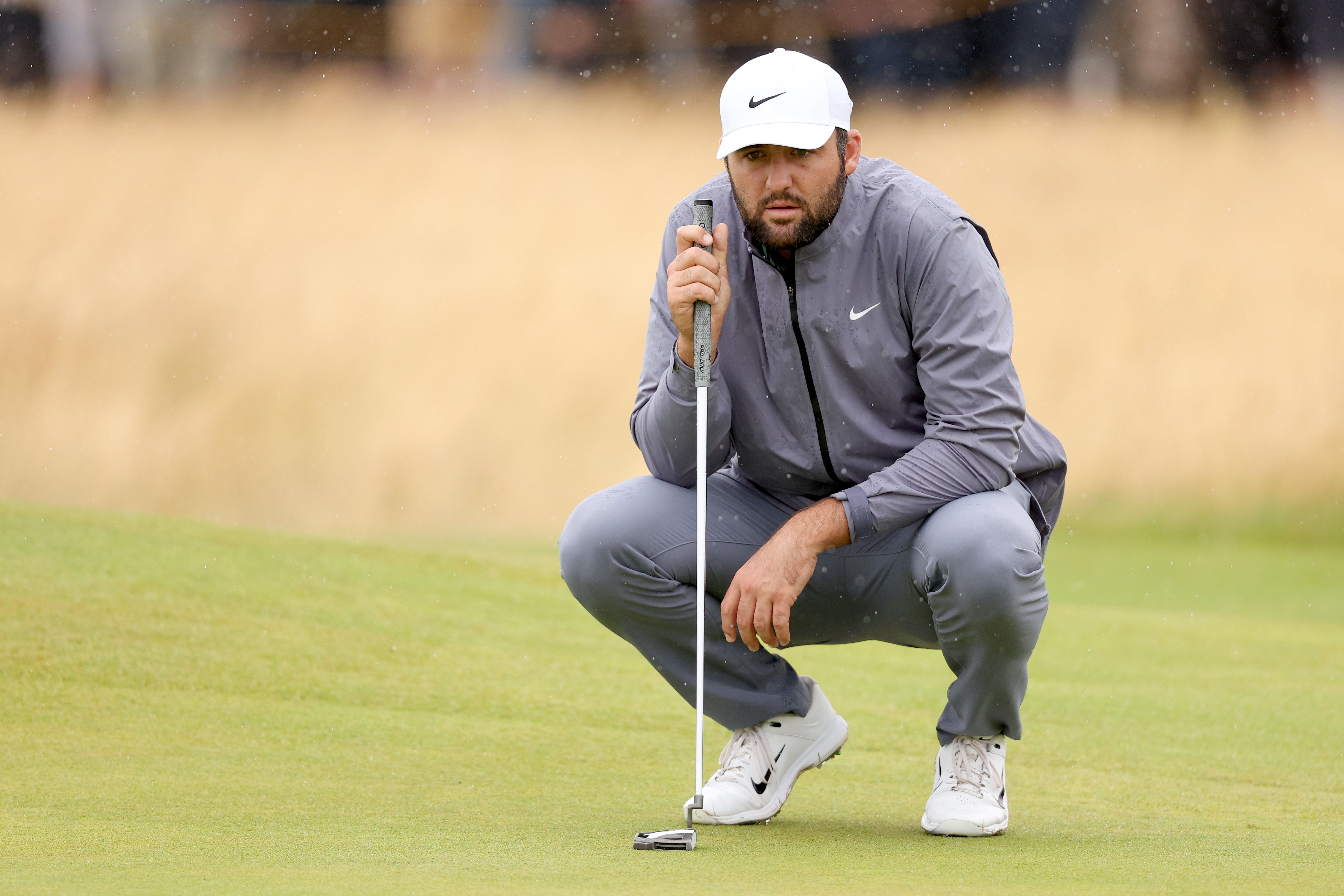 Scottie Scheffler lines up a putt during the third round