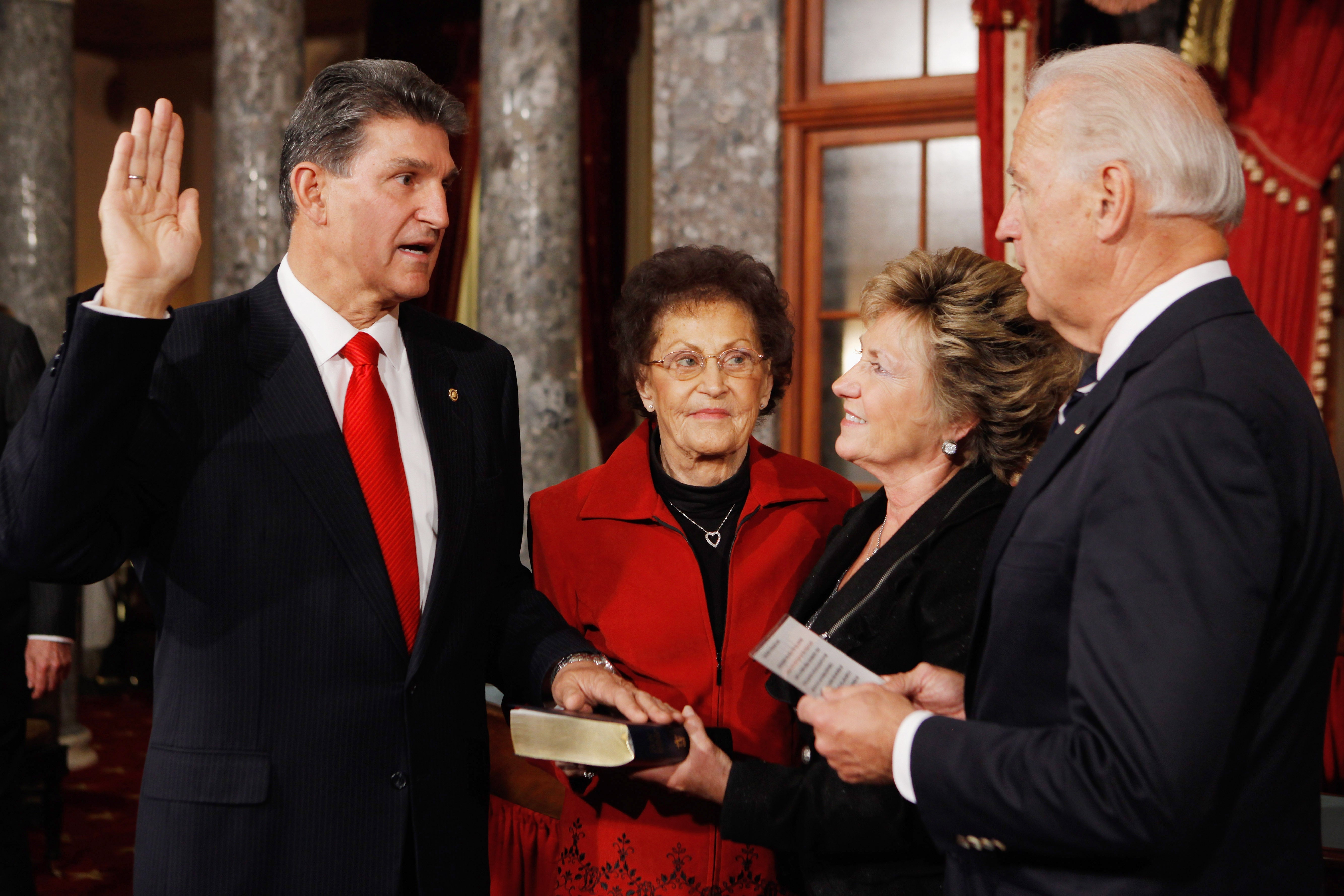 Manchin is sworn in by then-vice president Biden in November 2021