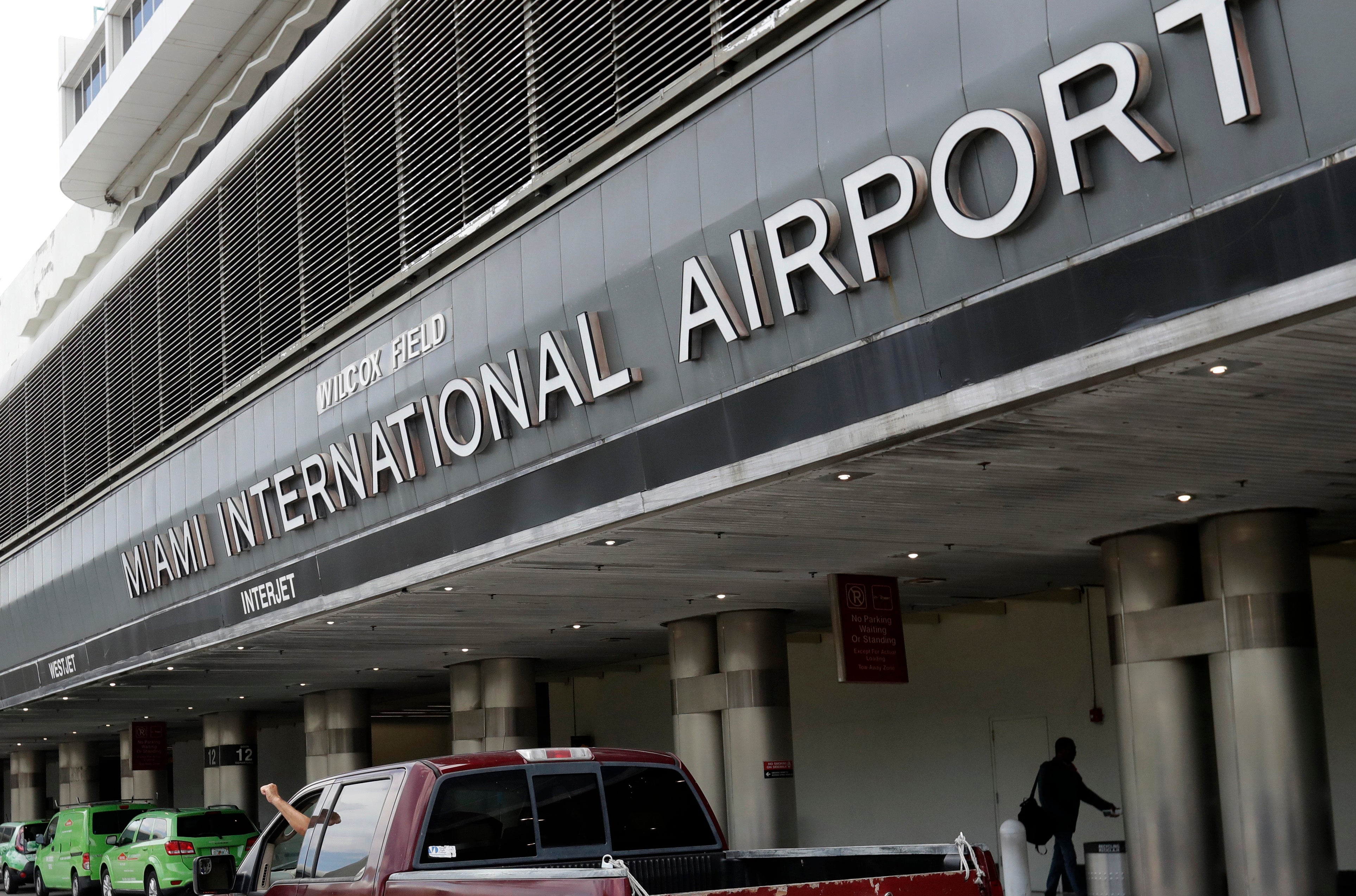 A man stabbed a woman at Miami International Airport Saturday night, setting off fears that an active shooter was in the termina