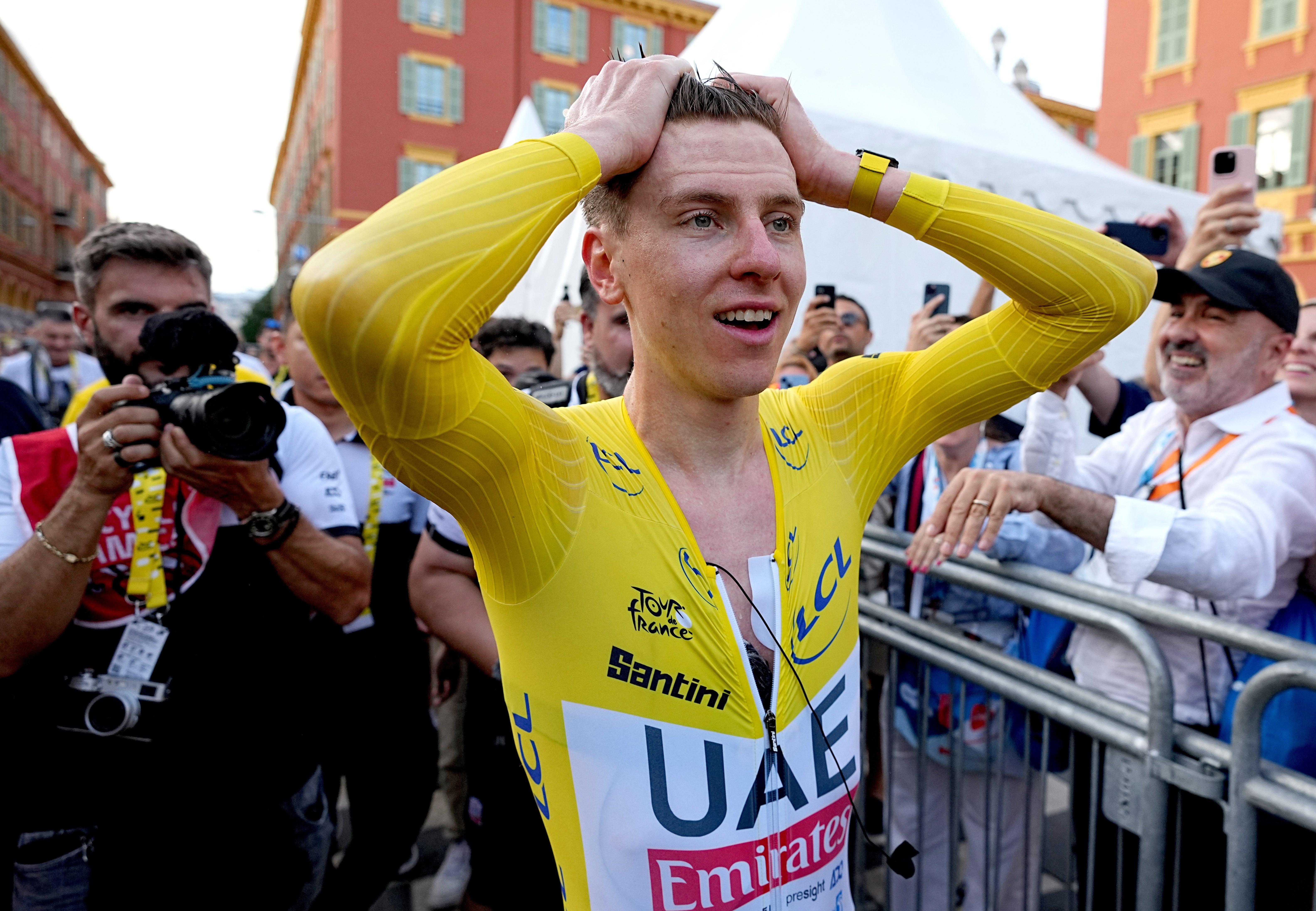 Tadej Pogacar reacts after clinching his third Tour de France win