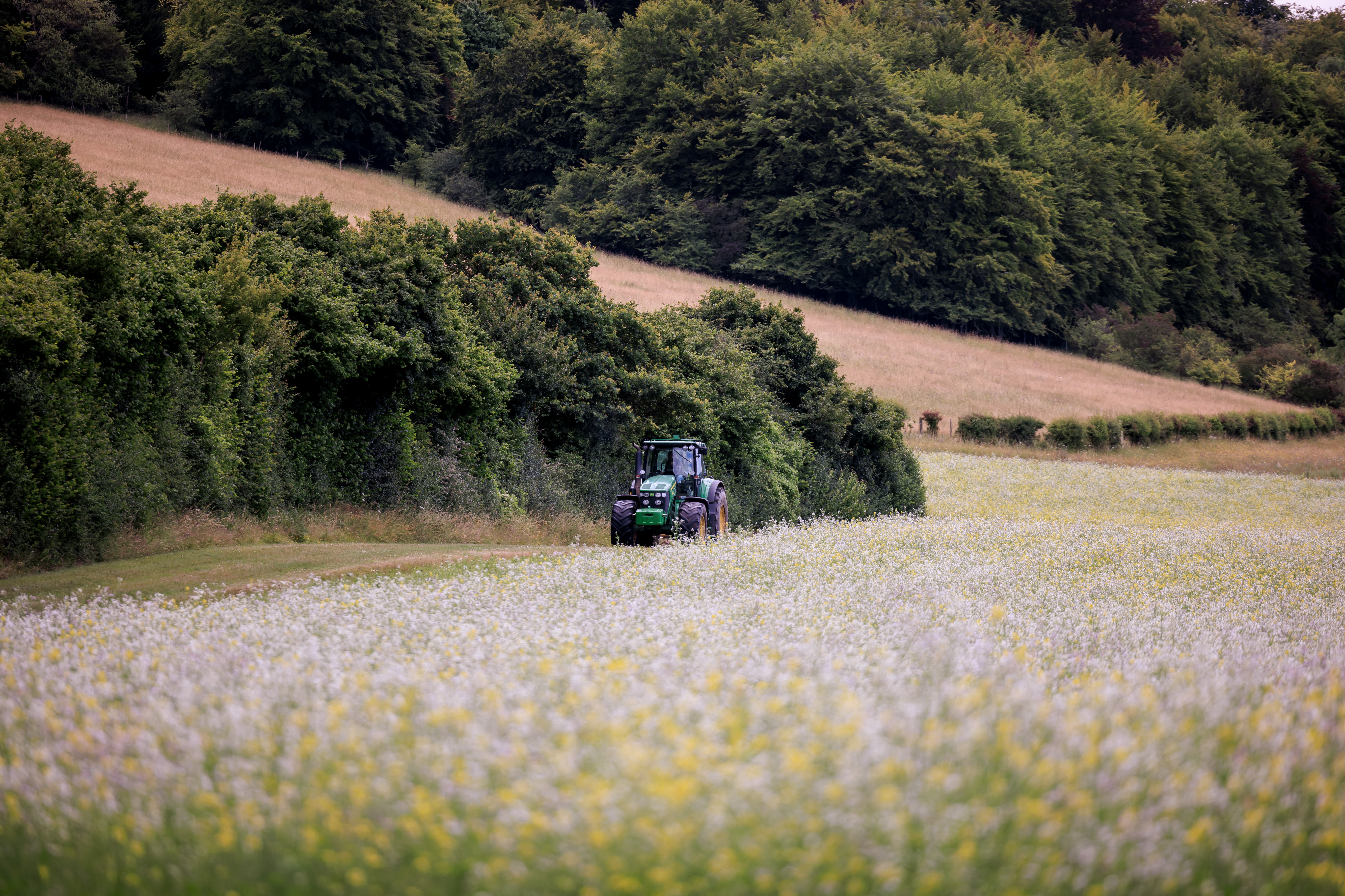 A tractor at work on Manor Farm in the Chilterns, part of the Chalk, Cherries and Chairs partnership (Oliver Dixon/National Lottery Heritage Fund/PA)