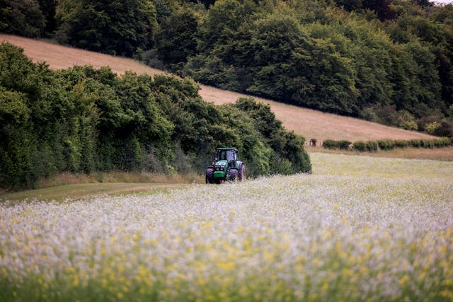 A tractor at work on Manor Farm in the Chilterns, part of the Chalk, Cherries and Chairs partnership (Oliver Dixon/National Lottery Heritage Fund/PA)