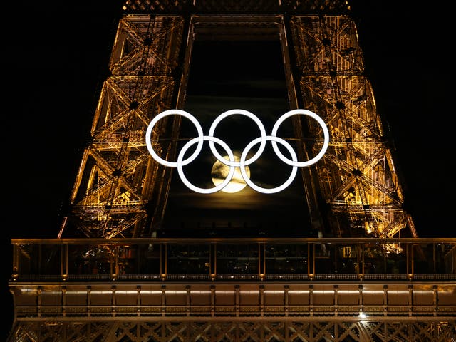 <p>The moon rises behind the Eiffel Tower and the Olympic Rings ahead of the Paris Games on 21 July 2024 in France</p>