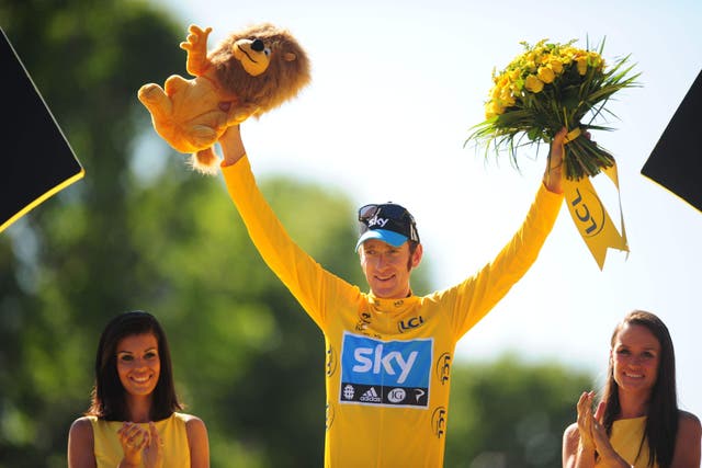 Great Britain’s Bradley Wiggins celebrates after winning the 2012 Tour de France (PA)