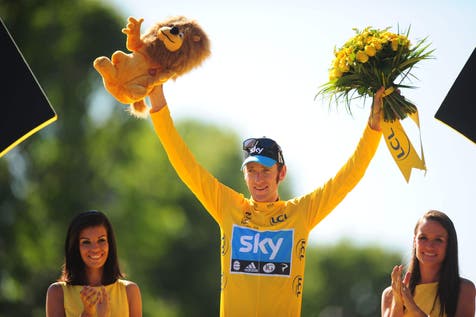 <p>Great Britain’s Bradley Wiggins celebrates after winning the 2012 Tour de France </p>