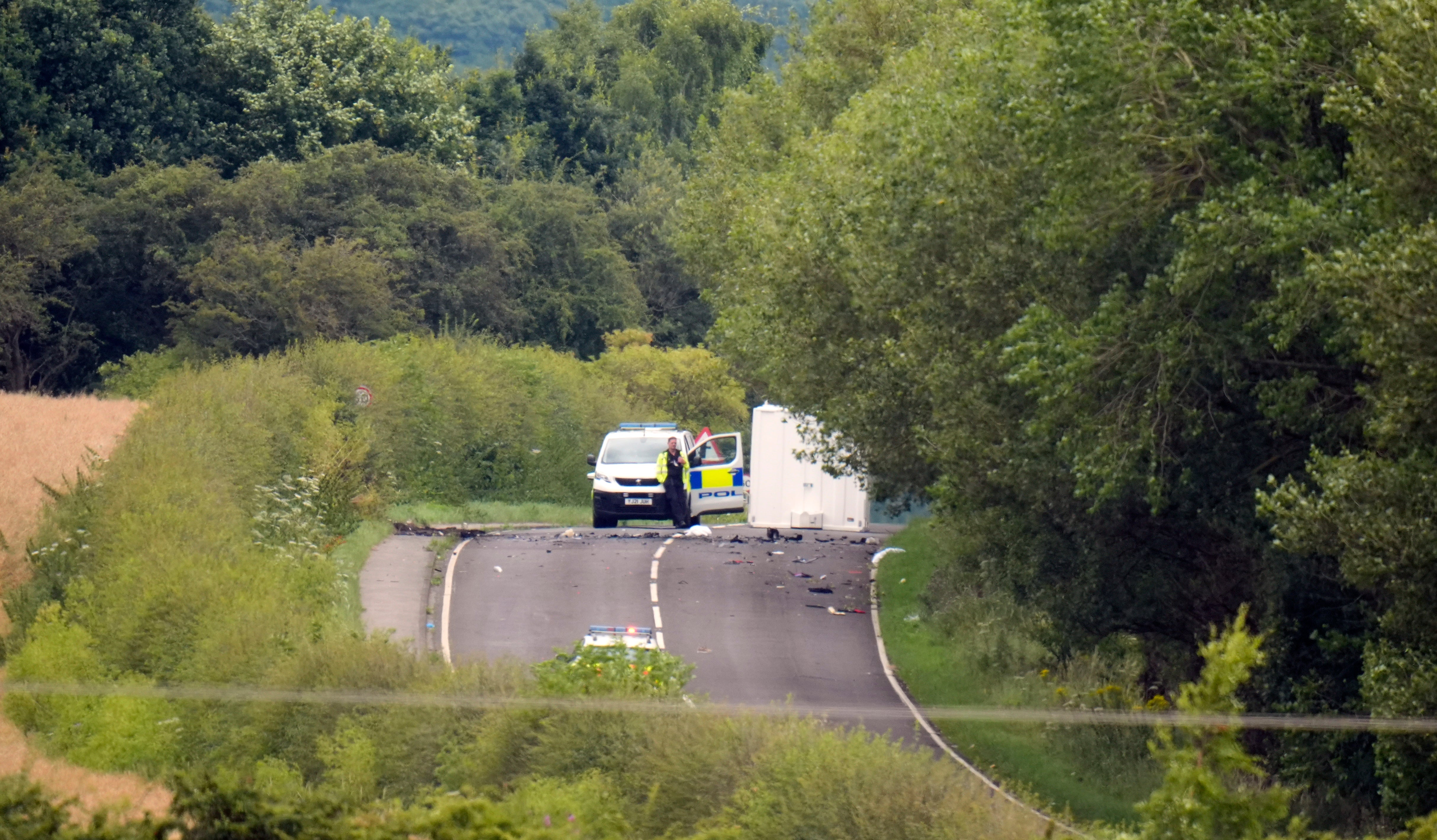 Grim photographs from the scene show debris strewn across the road