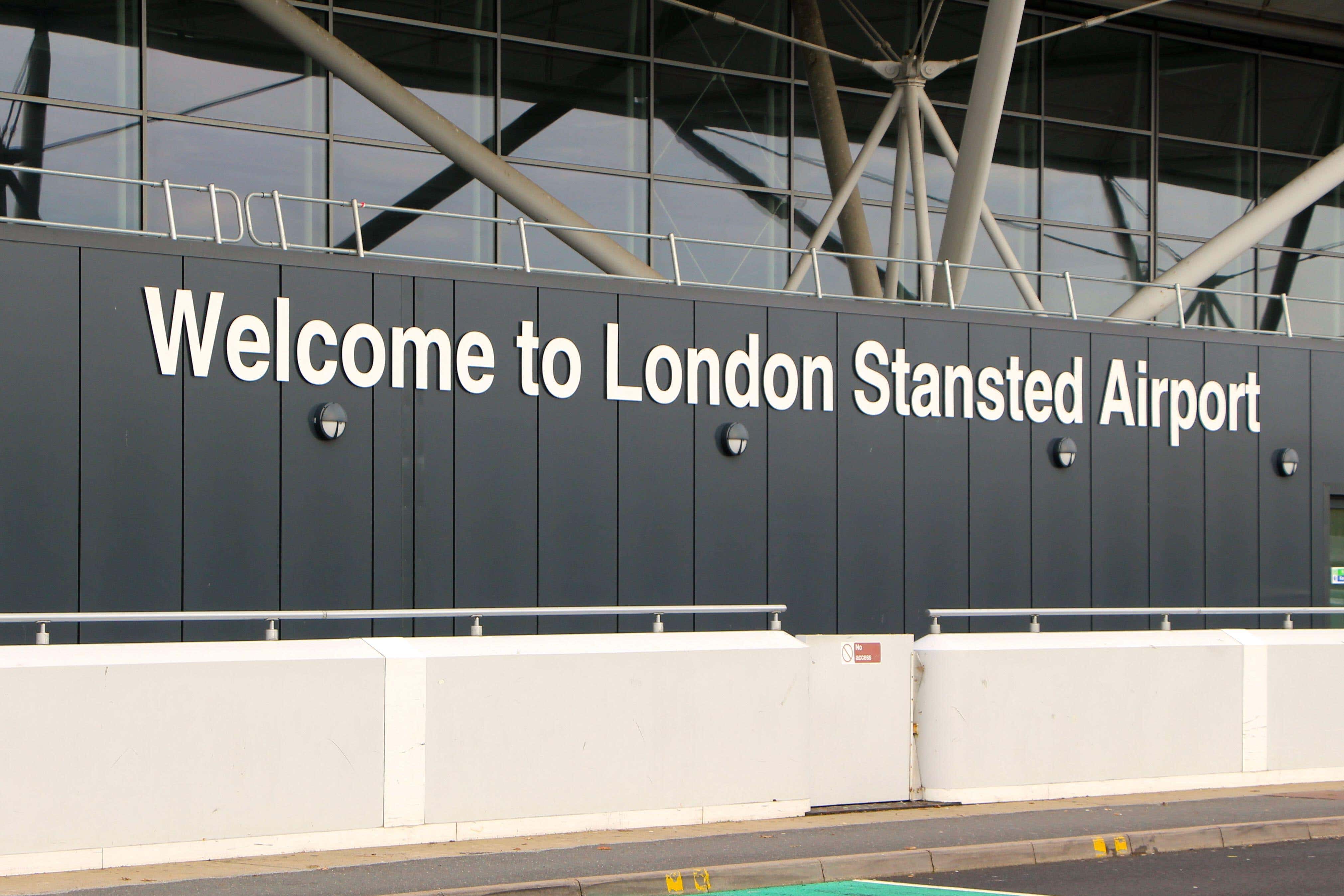 Two people are accused of damaging two jets that were sprayed with orange paint at Stansted Airport (Alamy/PA)