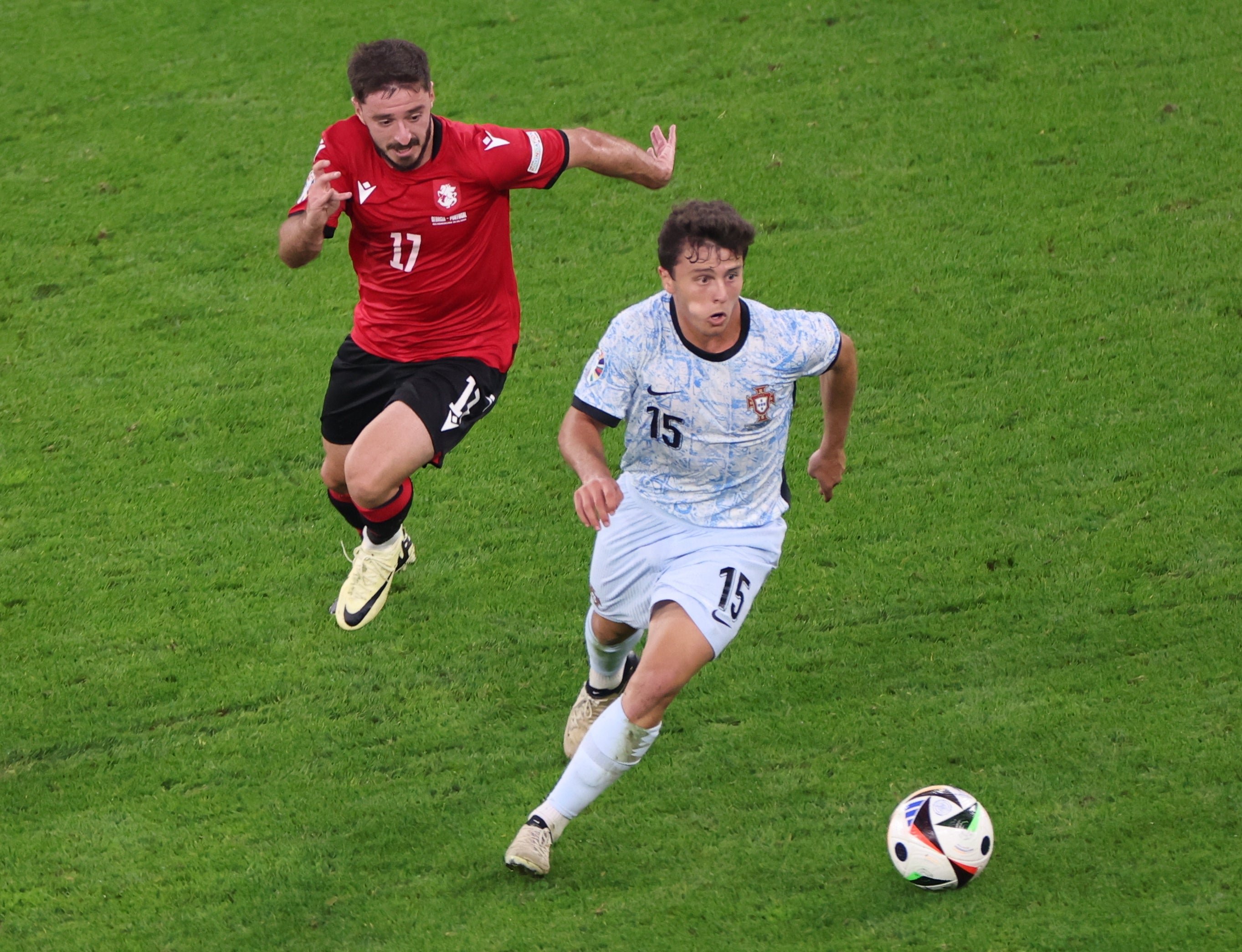 Otari Kiteishvili (L) of Georgia and Joao Neves of Portugal in action