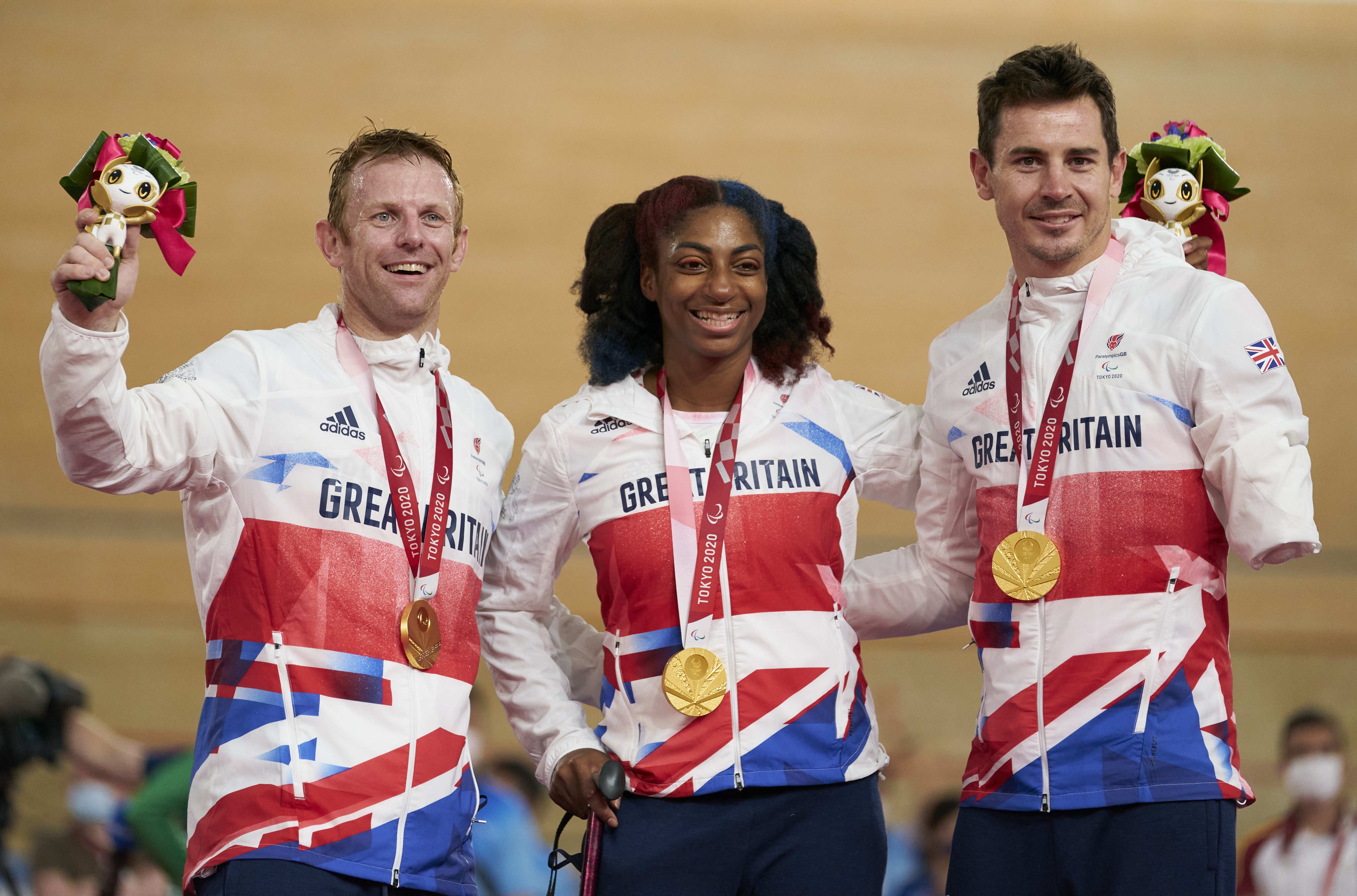 British cyclists Jody Cundy (left), Kadeena Cox (centre) and Jaco van Gass (right) will go to Paris