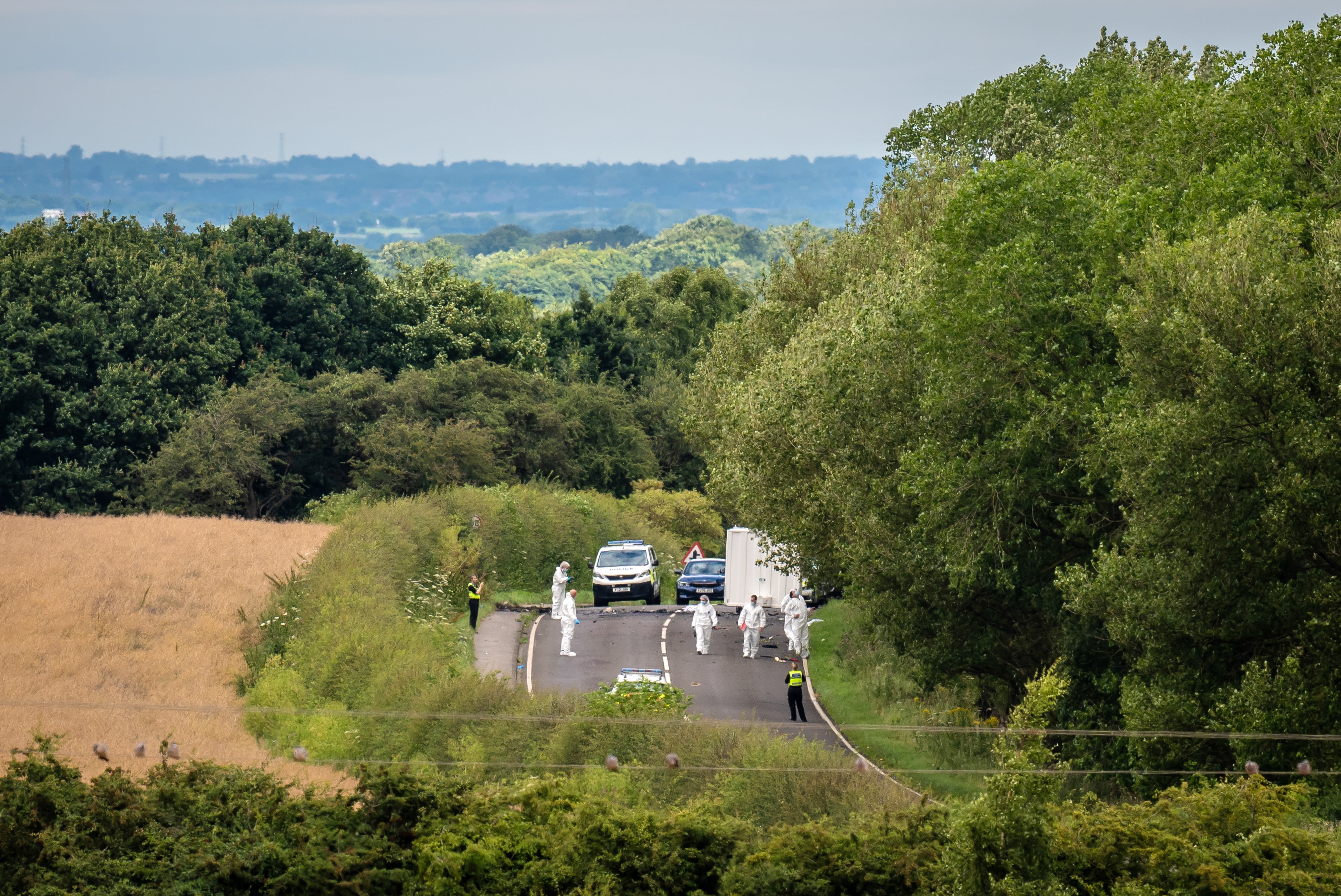 Forensic officers at the scene of the collision on the A61 in Wakefield