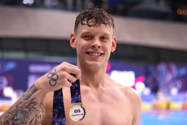 <p>Matt Richards celebrates with his medal after winning the men’s 100m freestyle at the British Swimming Championships in April </p>