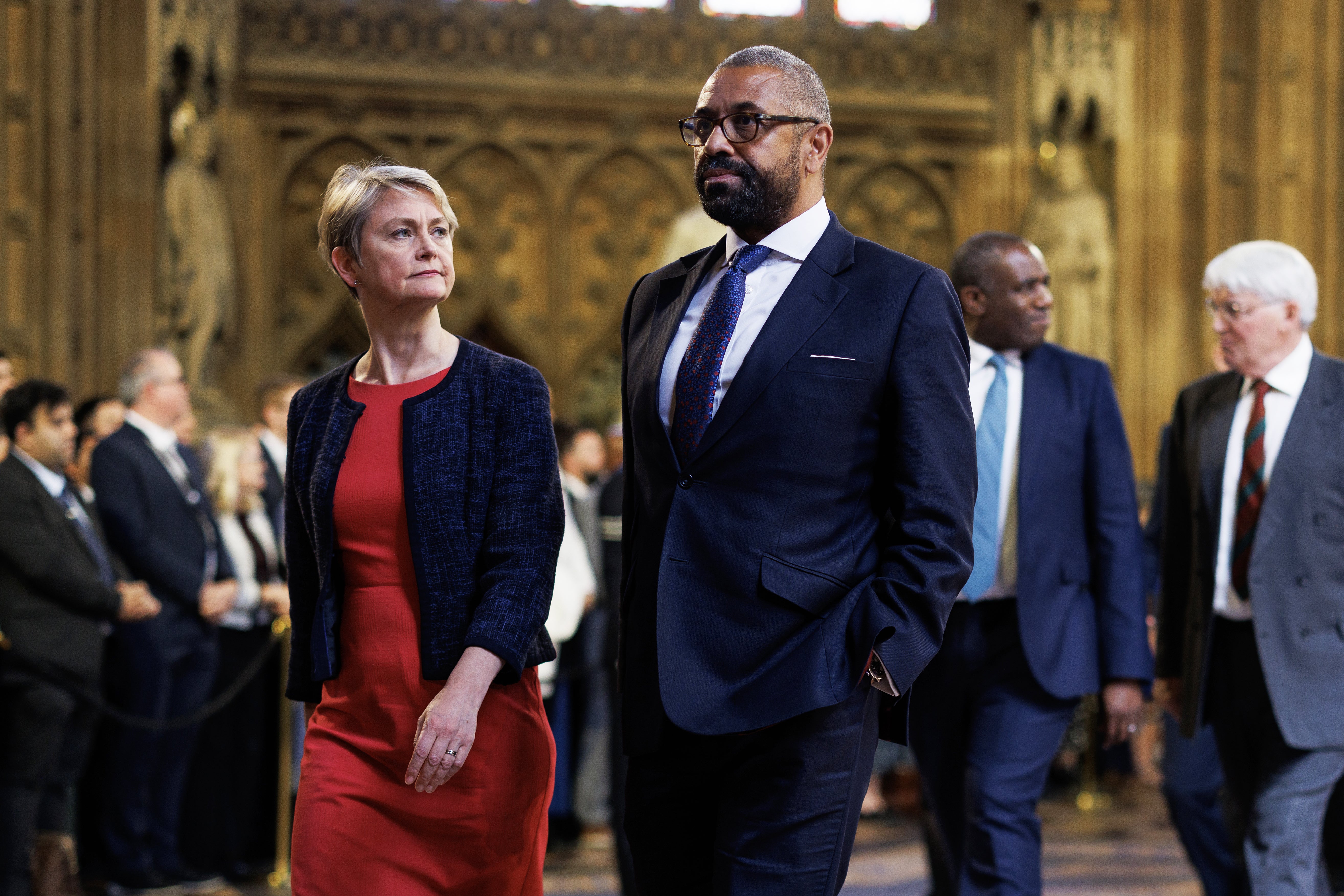 Home secretary Yvette Cooper and shadow home secretary James Cleverly walk through the central lobby of the Houses of Parliament