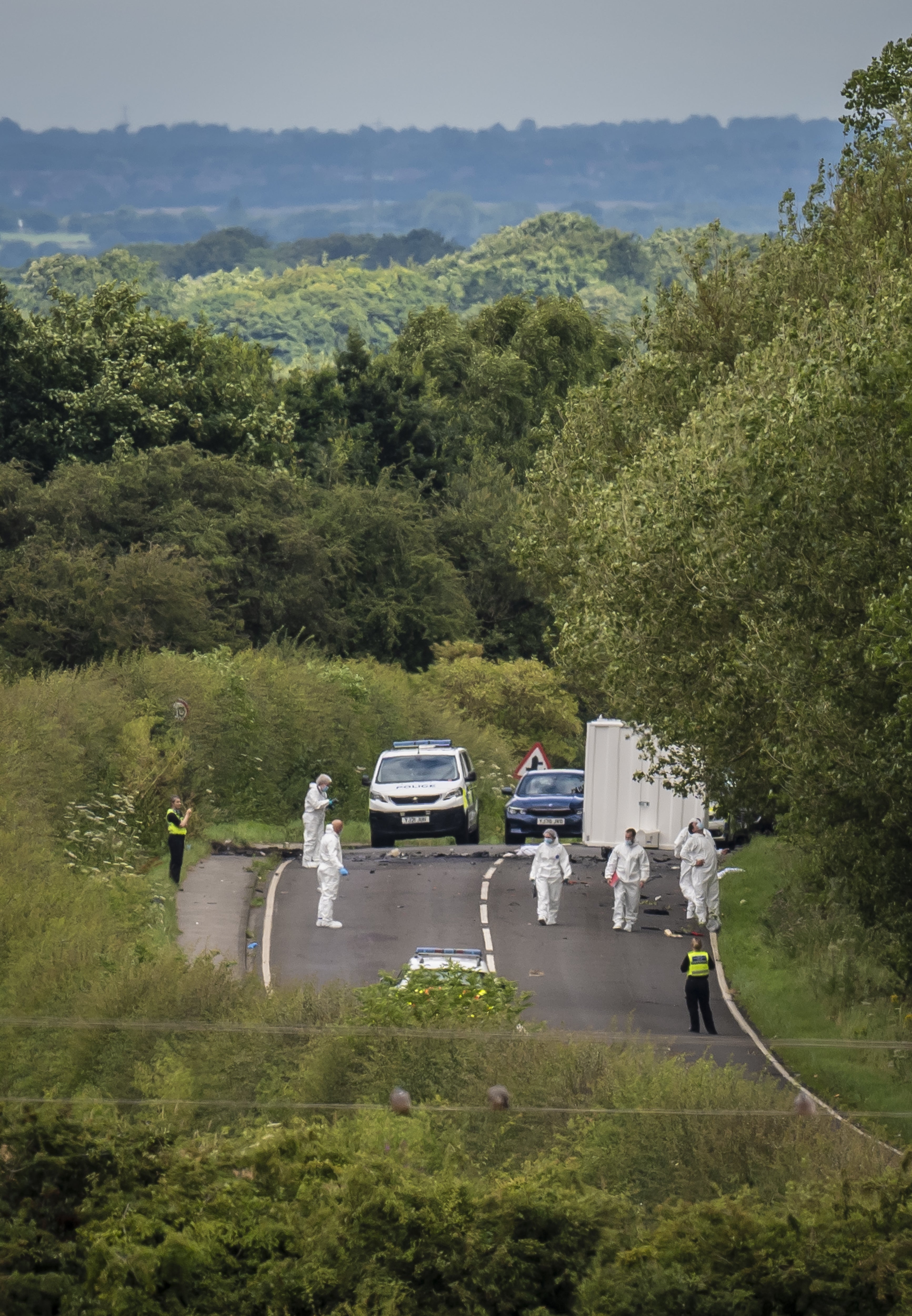 Forensic officers at the scene on the A61 in Wakefield (Danny Lawson/PA)