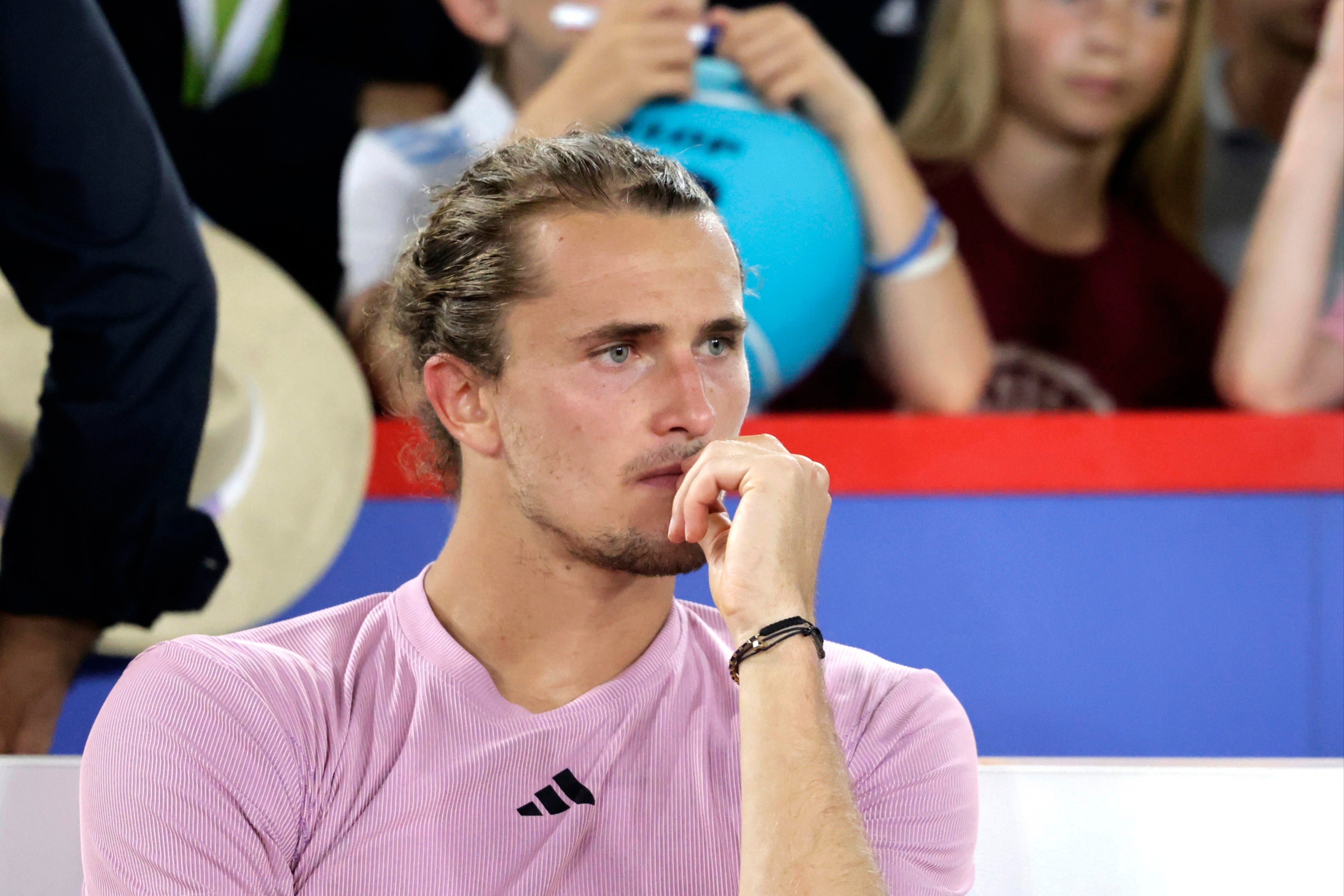 Alexander Zverev looks on in dejection after losing to Arthur Fils in Hamburg