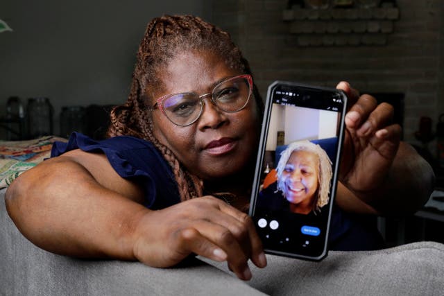 <p>Janet Jarrett shows a photo of her sister, Pamela Jarrett, in Spring, Texas. Pamela Jarrett died after suffering heat-related distress due to the power outage caused by Hurricane Beryl </p>