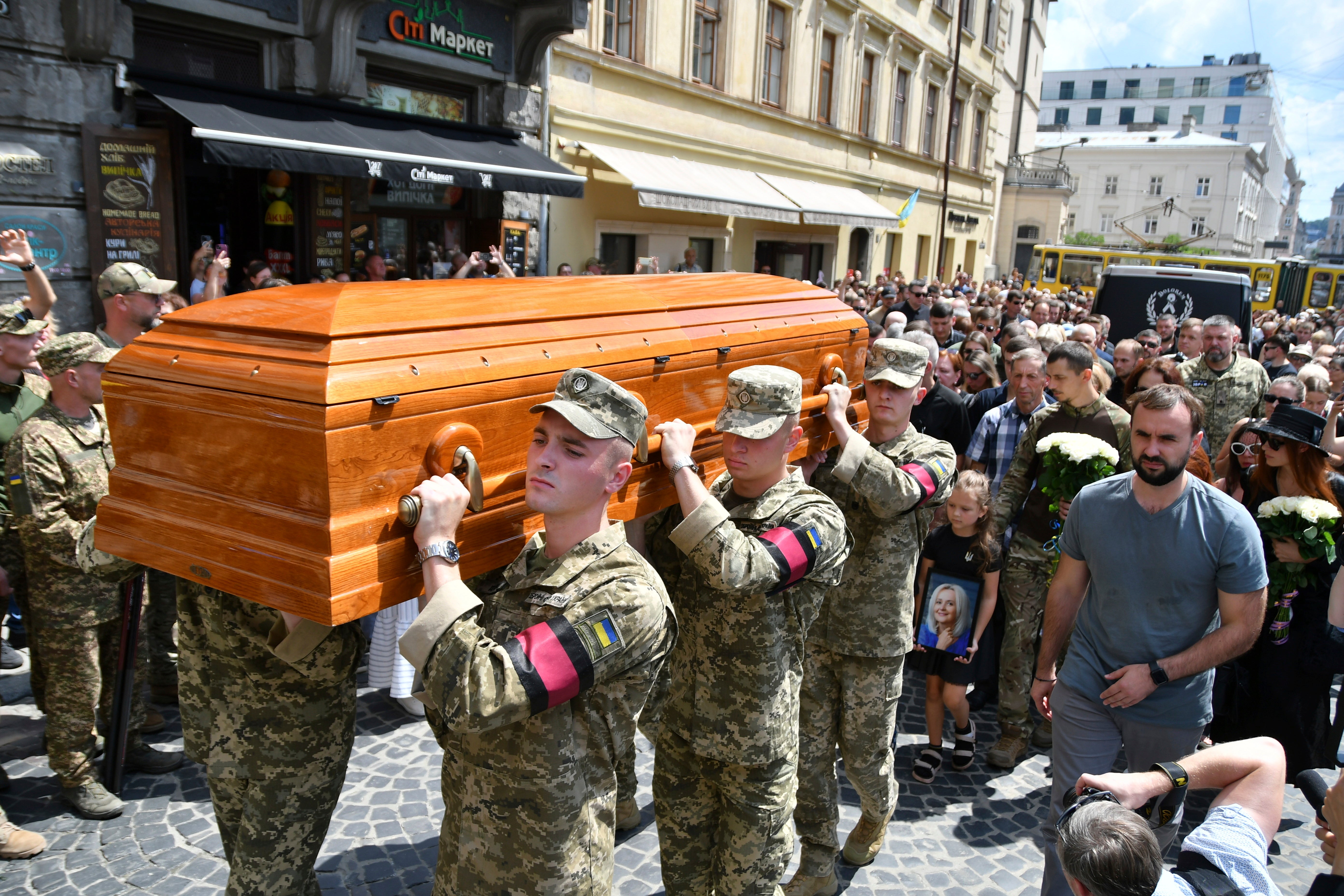 Soldiers carry the coffin of former Ukrainian nationalist lawmaker Iryna Farion during a funeral ceremony in Lviv